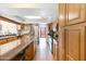 Bright, open kitchen with skylight, stainless steel appliances, and breakfast bar with seating at 5231 E Tamblo Dr, Phoenix, AZ 85044