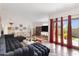Spacious living room with natural light, tile flooring, modern décor, and a comfortable sofa at 5231 E Tamblo Dr, Phoenix, AZ 85044