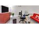 Bright office space with a large desk, shelving, and ample natural light at 5231 E Tamblo Dr, Phoenix, AZ 85044