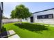 Beautiful backyard with lush artificial grass and a tree for privacy at 5404 N 41St St, Phoenix, AZ 85018