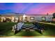 Expansive backyard featuring a giant chess set and a well-manicured lawn with the main house in the background at 5404 N 41St St, Phoenix, AZ 85018