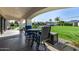 Inviting covered patio overlooking a sprawling backyard with a pool, lush greenery, and mountain views at 5404 N 41St St, Phoenix, AZ 85018