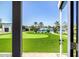 View of the landscaped backyard with a putting green, swimming pool, and a seating area at 5404 N 41St St, Phoenix, AZ 85018