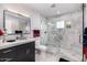 Modern bathroom featuring a glass-enclosed shower, stylish vanity, and contemporary fixtures at 5404 N 41St St, Phoenix, AZ 85018