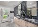 Elegant bathroom featuring a granite countertop, modern tiling, and ample natural light at 5404 N 41St St, Phoenix, AZ 85018