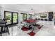 Spacious game room featuring a pool table, a wet bar with counter seating and an open view to the backyard at 5404 N 41St St, Phoenix, AZ 85018