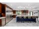 Modern kitchen with stainless steel appliances, large island, granite countertops, and pendant lighting at 5404 N 41St St, Phoenix, AZ 85018