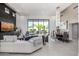 Spacious living room featuring a fireplace, large windows, and an open floor plan leading to the outdoor space at 5404 N 41St St, Phoenix, AZ 85018