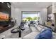 Inviting living room showcasing a modern fireplace, comfortable seating, and seamless access to the outdoor living area at 5404 N 41St St, Phoenix, AZ 85018