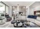 Stunning living room with a sleek sofa, glass coffee tables, and elegant decor at 5404 N 41St St, Phoenix, AZ 85018