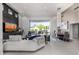 Bright open-plan living room with mountain views, modern furnishings, and a dazzling chandelier over the dining table at 5404 N 41St St, Phoenix, AZ 85018