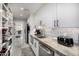 Pantry with white cabinets, stainless steel appliances, undermount sink and marbled countertops at 5404 N 41St St, Phoenix, AZ 85018