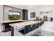Attractive wet bar including a quartz countertop, a beverage cooler, lighting, tv and display shelves at 5404 N 41St St, Phoenix, AZ 85018