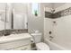 Clean bathroom featuring a shower-tub combination with classic tile and modern fixtures at 5407 S Tatum Ln, Gilbert, AZ 85298