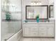 Beautifully designed bathroom with double sinks, vanity, large mirror and a shower at 5407 S Tatum Ln, Gilbert, AZ 85298