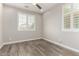 Bright bedroom with wood floors features white shutters and natural light at 5407 S Tatum Ln, Gilbert, AZ 85298