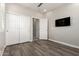 Neutral bedroom with hard floors features a closet and natural light for a calm ambiance at 5407 S Tatum Ln, Gilbert, AZ 85298