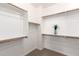 Walk-in closet with built-in shelves, rods, carpet floors and decor at 5407 S Tatum Ln, Gilbert, AZ 85298