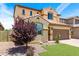 Charming two-story home with well-maintained landscaping and a two-car garage at 5407 S Tatum Ln, Gilbert, AZ 85298