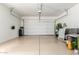 Spacious two car garage with epoxy floor, overhead storage, and plenty of room for vehicles at 5407 S Tatum Ln, Gilbert, AZ 85298