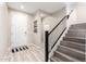 Hallway with tile floors, stairs, and front door at 5407 S Tatum Ln, Gilbert, AZ 85298