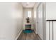 Hallway features a built-in desk with ample storage space and natural light at 5407 S Tatum Ln, Gilbert, AZ 85298
