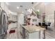Kitchen features stainless steel appliances, granite countertops, and an island with seating at 5407 S Tatum Ln, Gilbert, AZ 85298