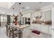 Bright kitchen featuring an island with barstool seating, stainless steel appliances, and modern pendant lighting at 5407 S Tatum Ln, Gilbert, AZ 85298