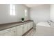 Bright laundry room with long countertop, ample cabinet space, and modern washer and dryer at 5407 S Tatum Ln, Gilbert, AZ 85298