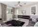 Beautiful living room features a modern fireplace, stylish rug and drapes at 5407 S Tatum Ln, Gilbert, AZ 85298