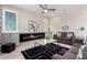 Comfortable living room features a cozy fireplace, stylish decor, and ample seating at 5407 S Tatum Ln, Gilbert, AZ 85298