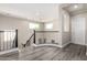 Upstairs loft with hardwood floors features windows and a staircase at 5407 S Tatum Ln, Gilbert, AZ 85298