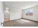 Spacious bedroom with a view of the backyard and a carpeted floor at 5516 E Mearn Rd, San Tan Valley, AZ 85140