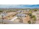 Stunning aerial view of the single-Gathering home nestled in a desert landscape with mountain views at 5670 E Singletree St, Apache Junction, AZ 85119