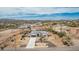 Gorgeous aerial view of a white single-story home with mountain views at 5670 E Singletree St, Apache Junction, AZ 85119