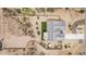 Overhead view of a home with a yard, bordered by a fence, and mature desert plants at 5670 E Singletree St, Apache Junction, AZ 85119