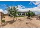 Backyard featuring trees, desert landscaping and turf at 5670 E Singletree St, Apache Junction, AZ 85119