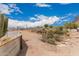 Desert backyard with fencing, mountain views and natural landscaping at 5670 E Singletree St, Apache Junction, AZ 85119