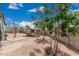Backyard featuring chicken coop, gravel landscaping and trees at 5670 E Singletree St, Apache Junction, AZ 85119