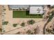 Overhead shot of a home's backyard with a patio, artificial turf, and desert landscaping at 5670 E Singletree St, Apache Junction, AZ 85119