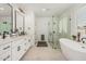 Elegant bathroom with a standalone tub, glass shower, and double vanity sinks at 5670 E Singletree St, Apache Junction, AZ 85119