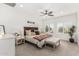 Comfortable bedroom featuring a ceiling fan, large windows, and stylish furniture at 5670 E Singletree St, Apache Junction, AZ 85119
