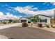 Well-maintained home with a large driveway, two-car garage, and appealing desert landscaping at 5670 E Singletree St, Apache Junction, AZ 85119