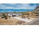 Beautiful single-story home with a long driveway and meticulously xeriscaped front yard with a mountain backdrop at 5670 E Singletree St, Apache Junction, AZ 85119