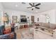 Inviting living room featuring hardwood floors, a ceiling fan, and ample seating at 5670 E Singletree St, Apache Junction, AZ 85119