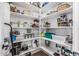 Walk-in pantry with white shelves stocked with a variety of household goods at 5670 E Singletree St, Apache Junction, AZ 85119
