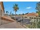 View from balcony, with palm tree and neighborhood features, in this condo community at 5808 E Brown Rd # 49, Mesa, AZ 85205