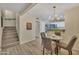 Chic dining area near the staircase, featuring modern lighting and an open view to the kitchen at 5808 E Brown Rd # 49, Mesa, AZ 85205