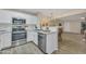 Bright kitchen with stainless steel appliances and white cabinetry, open to the dining area at 5808 E Brown Rd # 49, Mesa, AZ 85205