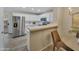 Modern kitchen with stainless steel appliances, white cabinets, and breakfast bar seating at 5808 E Brown Rd # 49, Mesa, AZ 85205